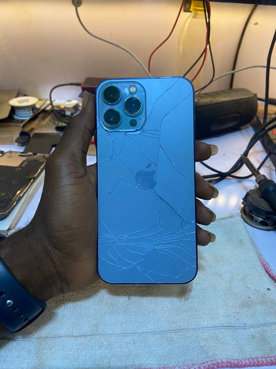 iPhone 13 Pro Max with a cracked back before repair